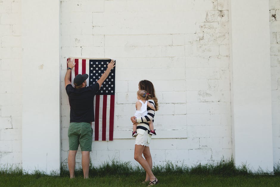 Family putting up a flag representing community